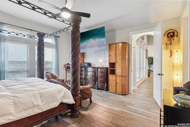 bedroom featuring light hardwood / wood-style floors and ceiling fan