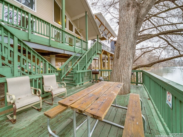 wooden terrace featuring a water view