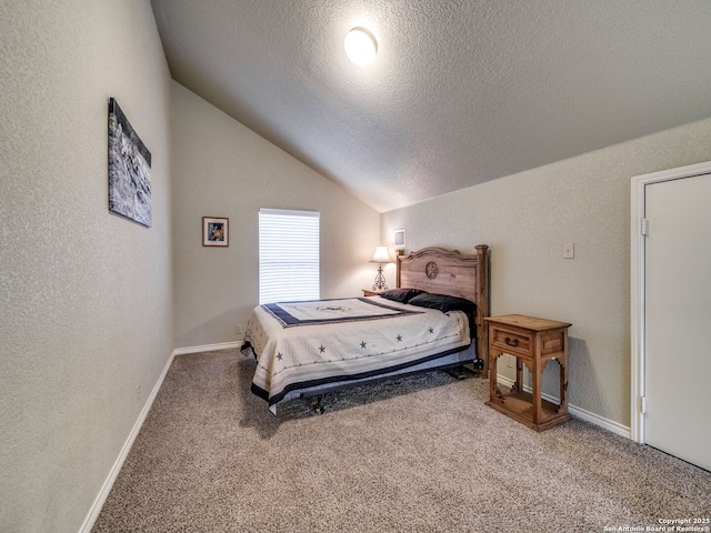 carpeted bedroom with lofted ceiling and a textured ceiling