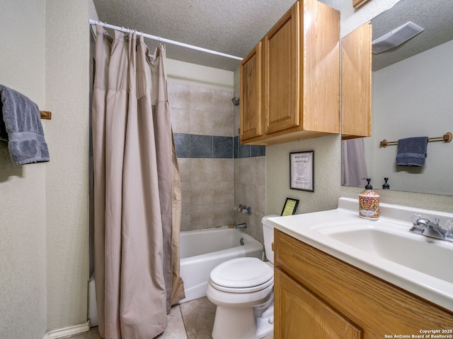 full bathroom featuring shower / tub combo with curtain, toilet, a textured ceiling, vanity, and tile patterned flooring