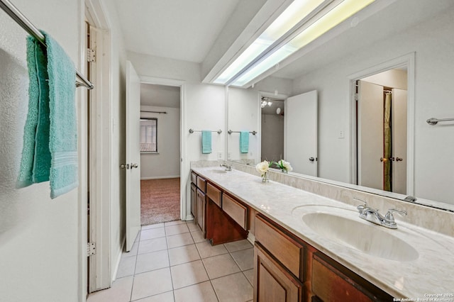 bathroom featuring tile patterned flooring and vanity