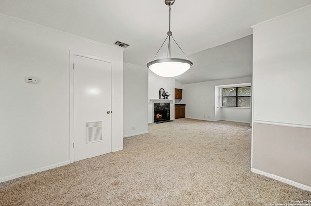 unfurnished living room featuring a fireplace and carpet floors