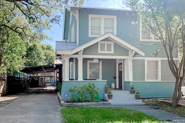 view of front of home featuring a carport