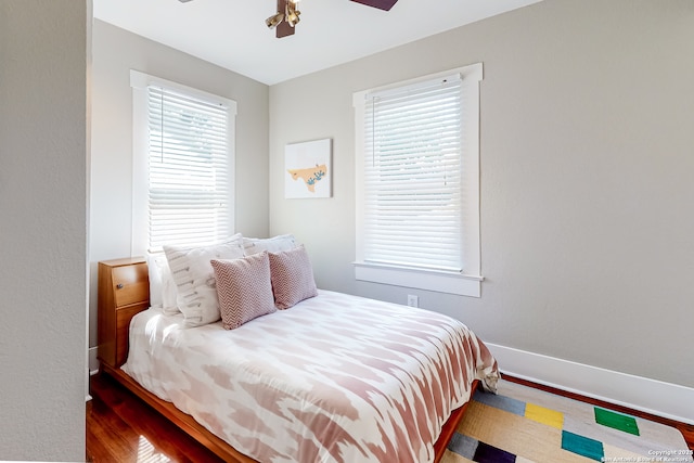 bedroom with hardwood / wood-style flooring and ceiling fan