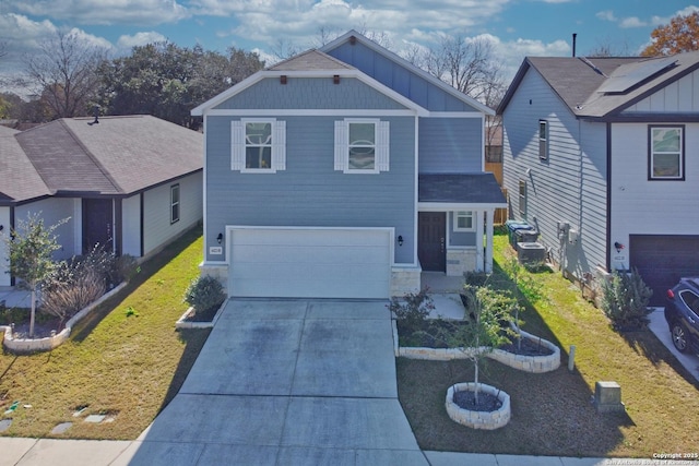 view of front of property featuring a garage and a front yard