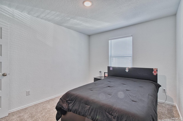 carpeted bedroom with a textured ceiling