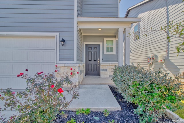 doorway to property featuring a garage