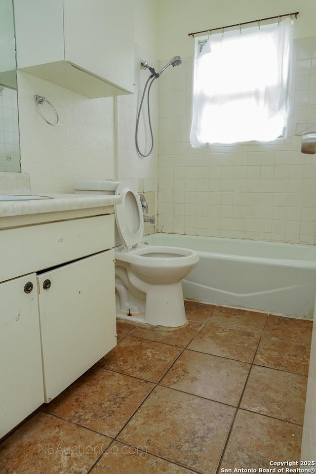 bathroom with toilet, tile patterned flooring, bathtub / shower combination, and vanity