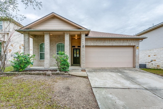 view of front of house featuring a porch and a garage