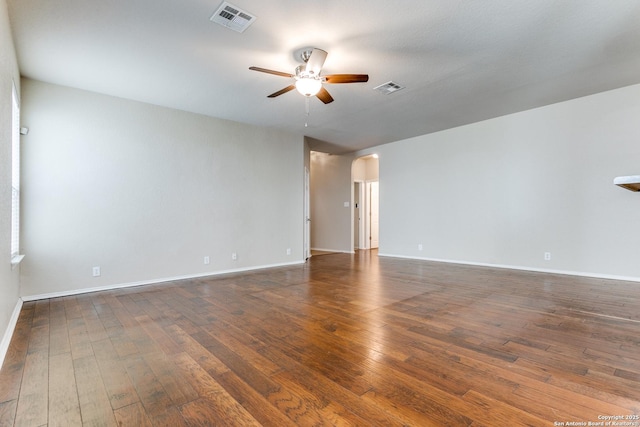 spare room with dark hardwood / wood-style floors and ceiling fan