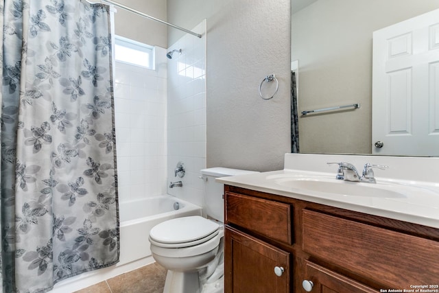 full bathroom with vanity, tile patterned flooring, toilet, and shower / bath combo with shower curtain