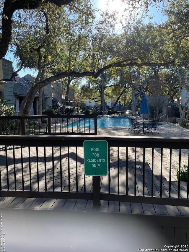 view of swimming pool featuring a patio