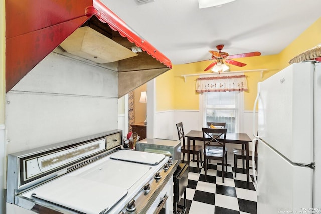 kitchen featuring ceiling fan and white refrigerator