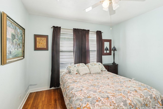 bedroom featuring ceiling fan and dark hardwood / wood-style flooring