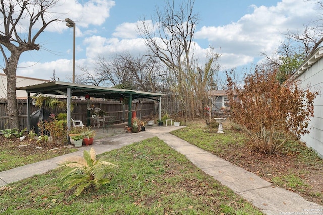 view of yard with a carport