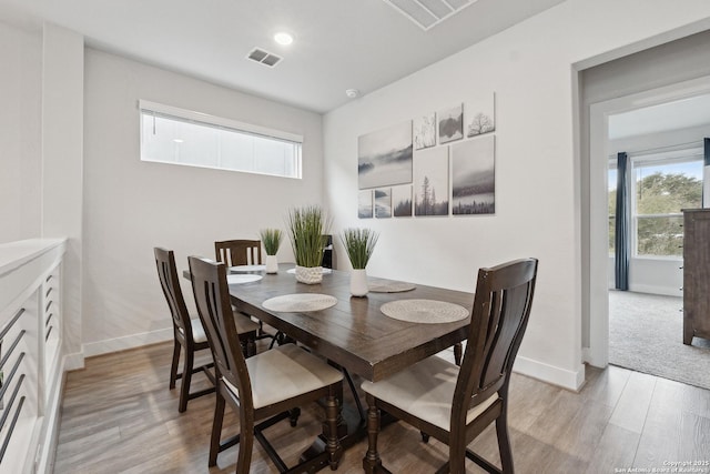 dining area with light wood-type flooring