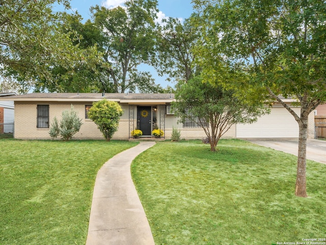 view of front of home featuring a garage and a front yard