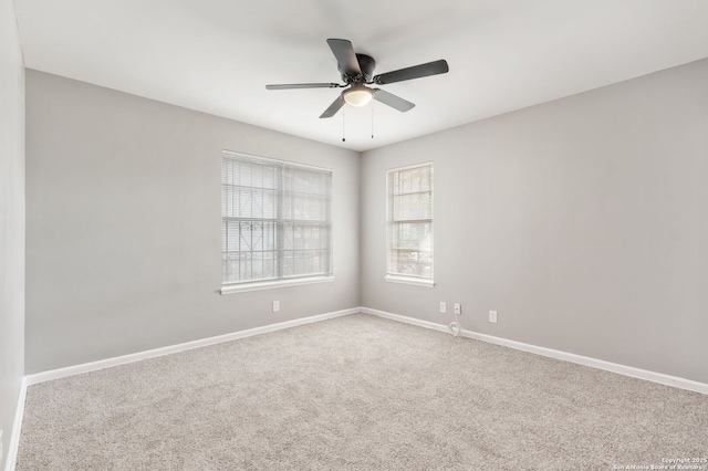 spare room with ceiling fan and carpet floors