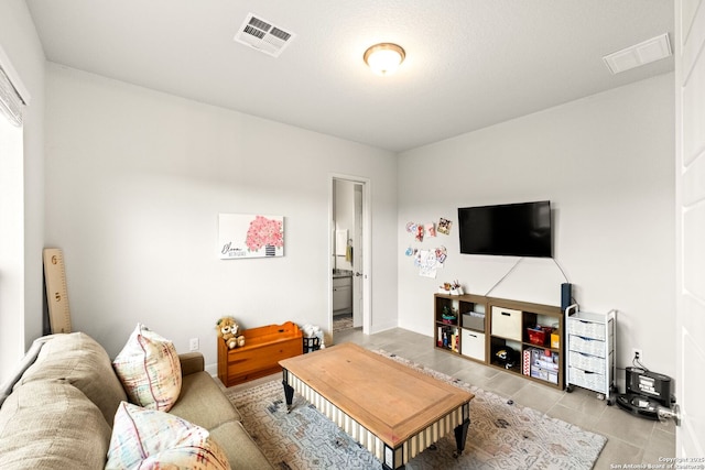 living room with light tile patterned floors