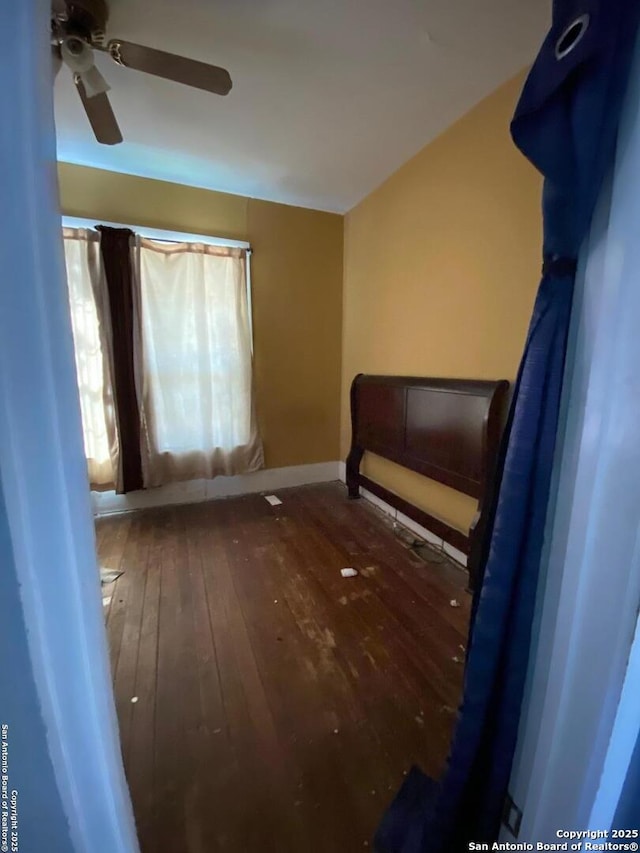 unfurnished bedroom with hardwood / wood-style floors and ceiling fan