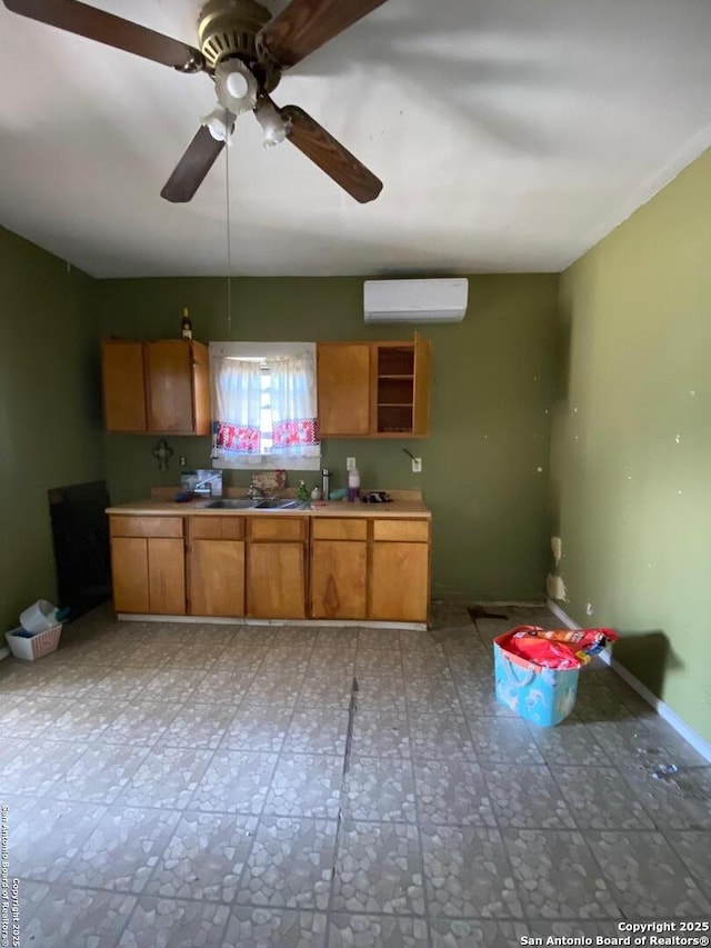 kitchen featuring ceiling fan and a wall mounted AC