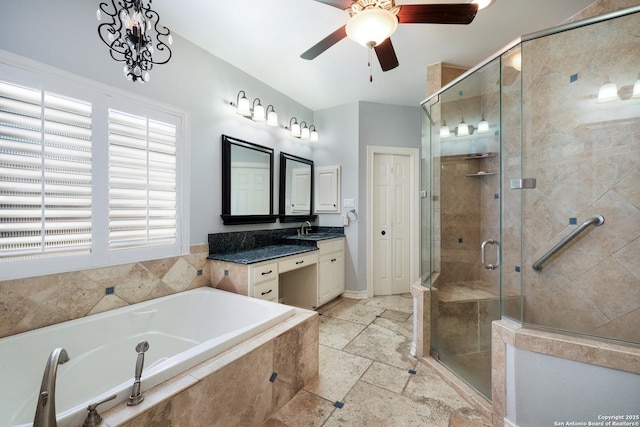 bathroom with ceiling fan, vanity, and separate shower and tub