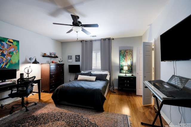 bedroom featuring ceiling fan and light wood-type flooring