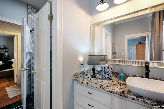 bathroom featuring vanity and hardwood / wood-style floors