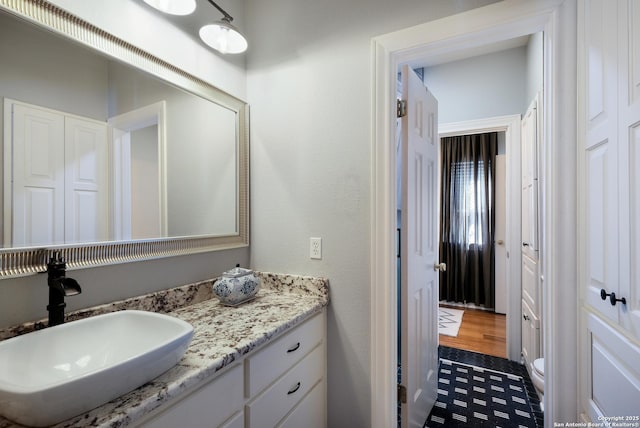 bathroom with vanity and toilet