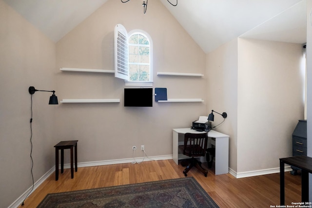 office featuring lofted ceiling and wood-type flooring