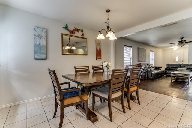 tiled dining space featuring ceiling fan