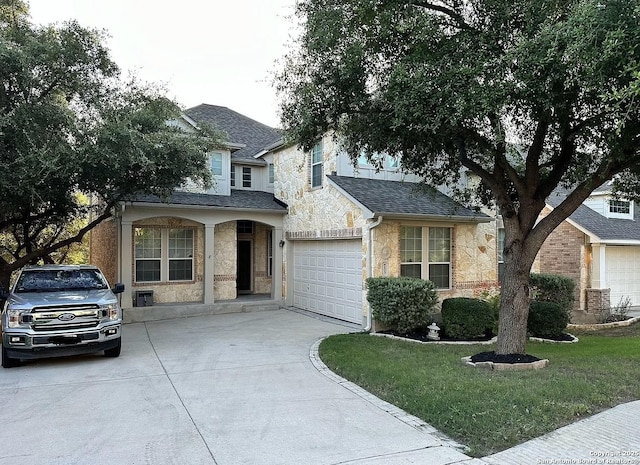 view of front of house featuring a garage and a front yard