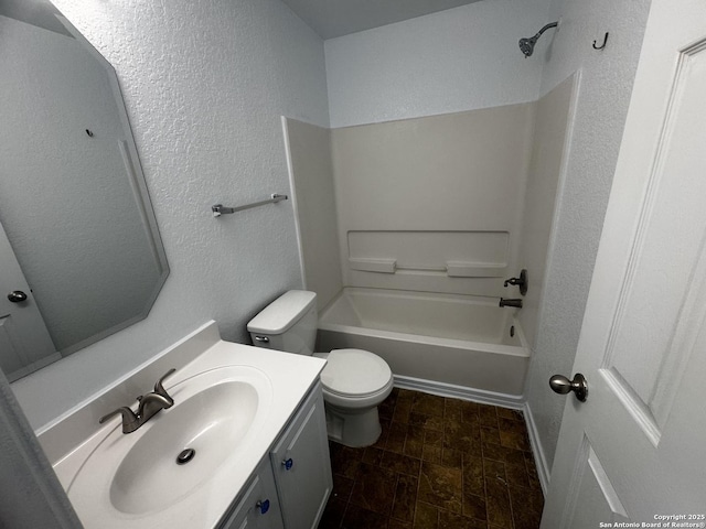 full bathroom featuring vanity, shower / washtub combination, and toilet