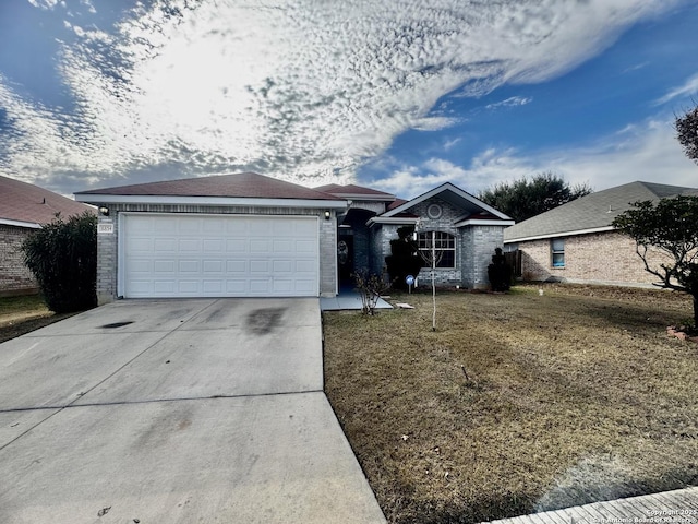 ranch-style home with a garage and a front yard