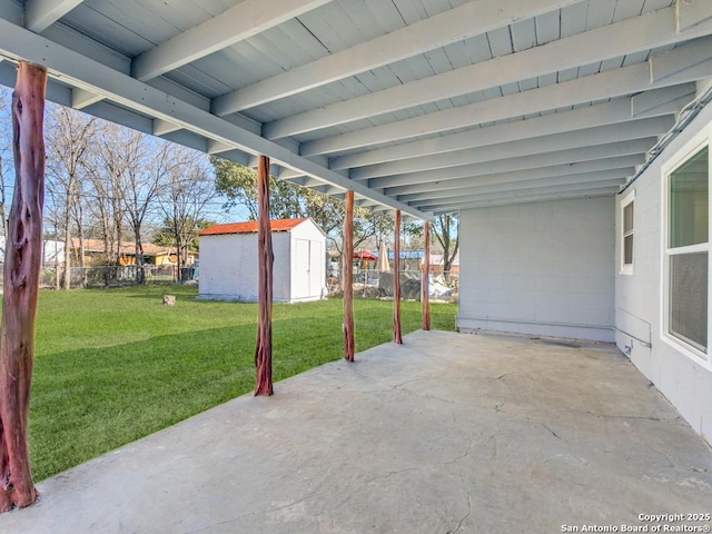 view of patio / terrace with a storage shed