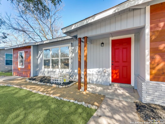 view of exterior entry with covered porch