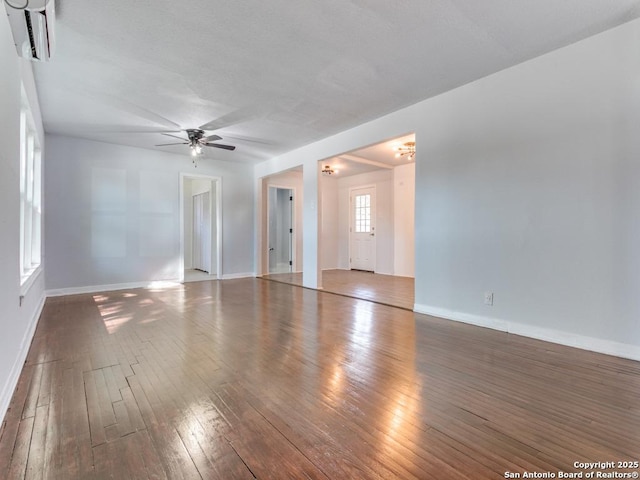 spare room with dark wood-type flooring and ceiling fan