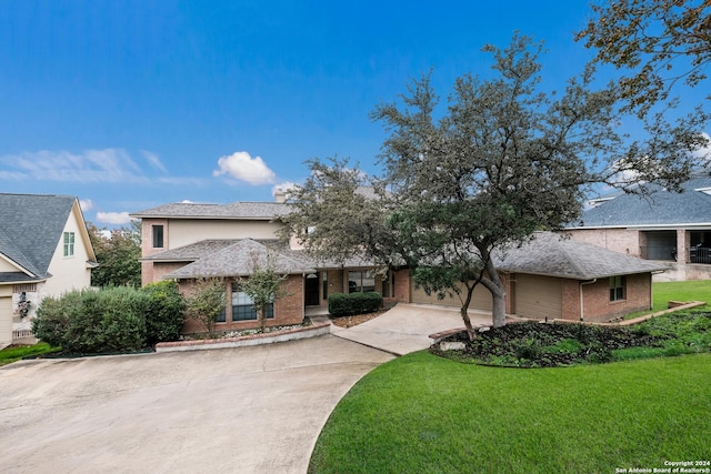 view of front of property with a garage and a front lawn