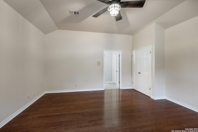 spare room featuring ceiling fan, lofted ceiling, and dark hardwood / wood-style flooring