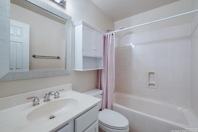 full bathroom with vanity, shower / bath combination with curtain, and toilet