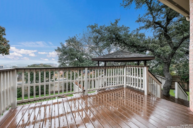 wooden deck featuring a gazebo