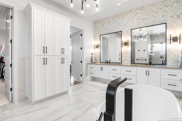 bathroom featuring tasteful backsplash, vanity, and an enclosed shower