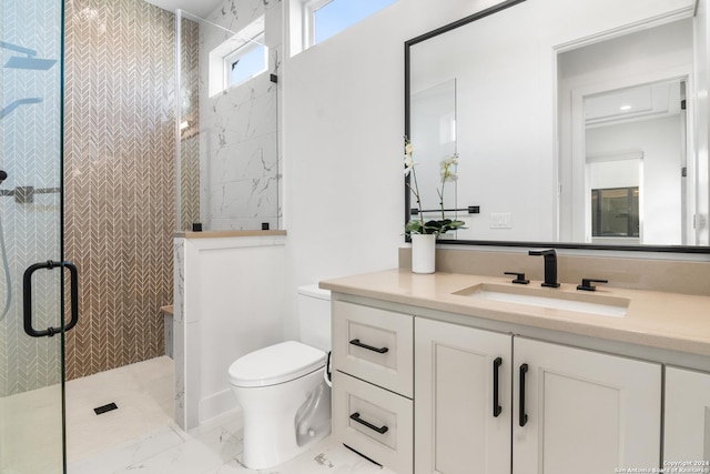 bathroom with vanity, toilet, and walk in shower