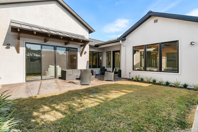 back of house featuring an outdoor hangout area, a yard, and a patio area