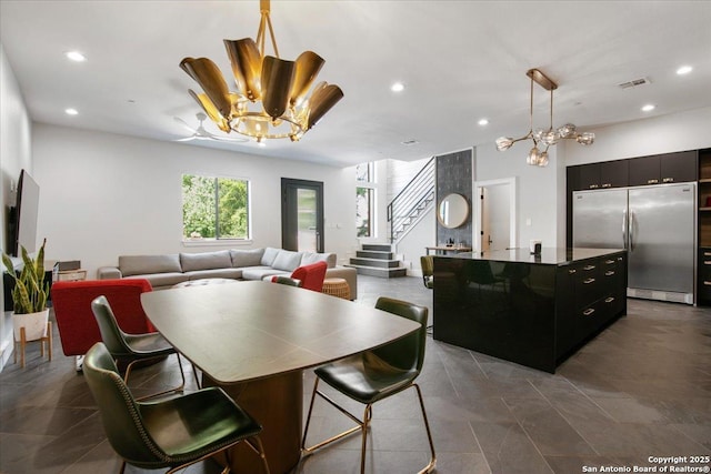 dining space featuring a notable chandelier