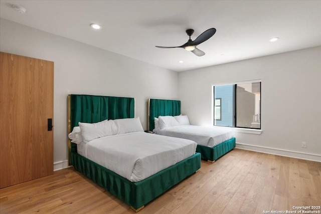 bedroom with hardwood / wood-style flooring and ceiling fan