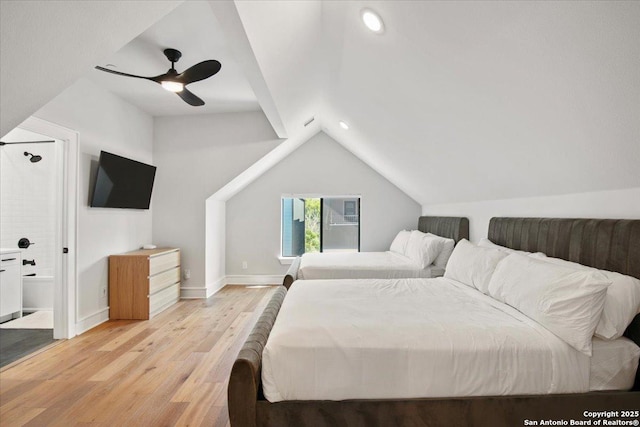 bedroom with ceiling fan, lofted ceiling, and light wood-type flooring