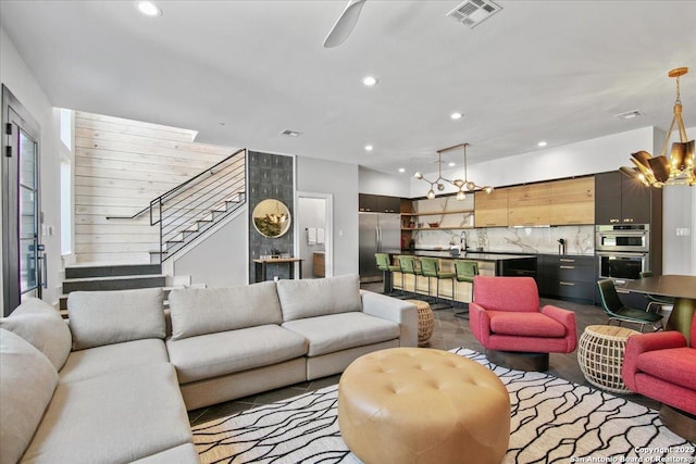 living room featuring a chandelier