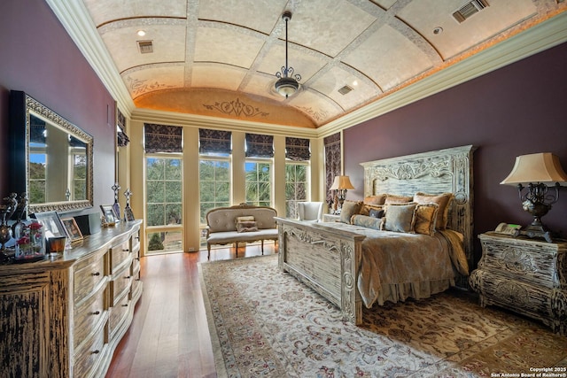 bedroom featuring hardwood / wood-style flooring and vaulted ceiling