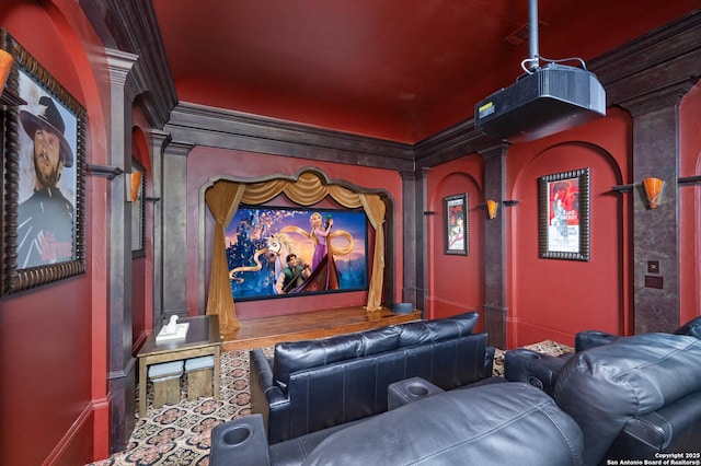 home theater with crown molding and ornate columns